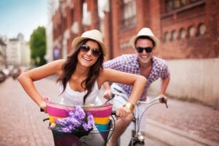 Happy expats cycling abroad