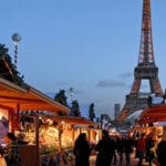 Spending Christmas abroad? Visit Christmas markets, like this one in Paris by the Eiffel Tower