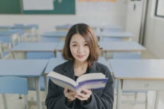 A student sitting in an international school classroom