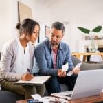 an expat couple doing their taxes