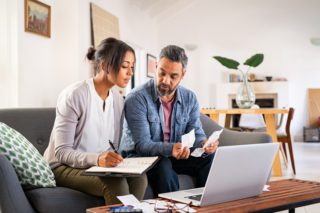 an expat couple doing their taxes