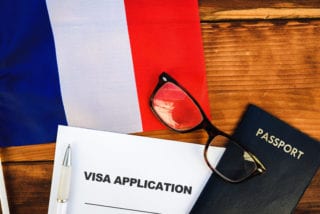 Visa Application with French flag and passport