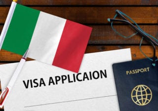 visa application with passport and Italian flag