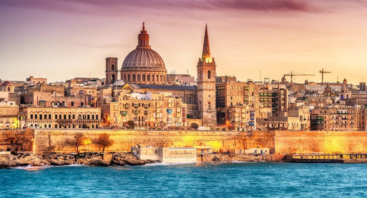 Valletta, Malta at sunset. A beautiful option for expats to live and work.