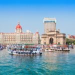 The Gateway of India and boats as seen from the Mumbai Harbour in Mumbai, India