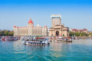 The Gateway of India and boats as seen from the Mumbai Harbour in Mumbai, India, which has the most expensive cost of living in India