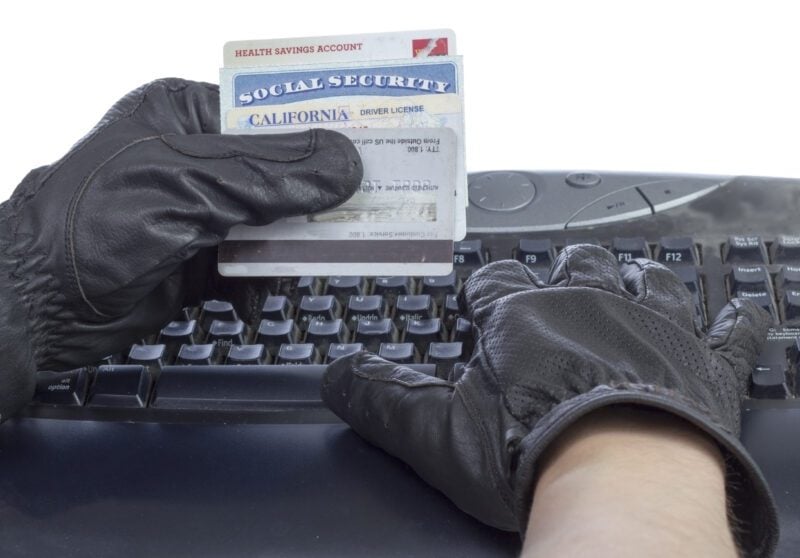 Identification documents (social security, driver license and credit cards) in hand of thief
