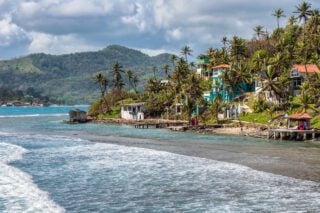 Houses on the sea in Isla Grande, Panama