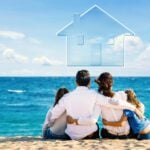 Family on a beach dreaming of purchasing a home overseas