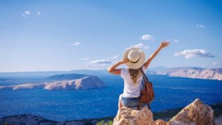 Woman traveler enjoying panoramic breathtaking