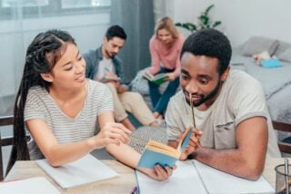 young happy students studying the French language