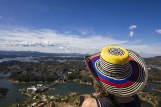 Young woman at Guatape lake in Antioquia Colombia