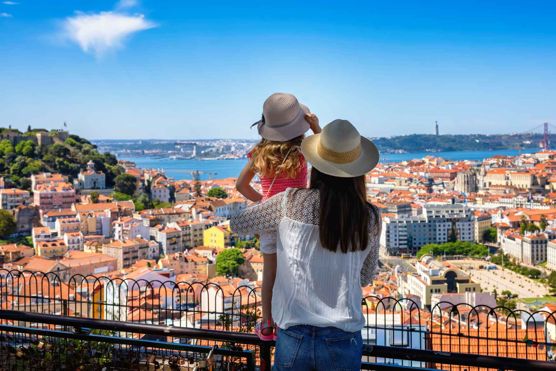 lisbon-portugal a mother and her daughter enjoying the view of the beautiful cityscape of Lisbon, ones of the best places to live in Europe and one of the safest places to live in the world