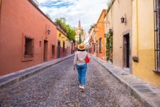 a woman walking in San Miguel de Allende Mexico, after moving to Mexico from the US