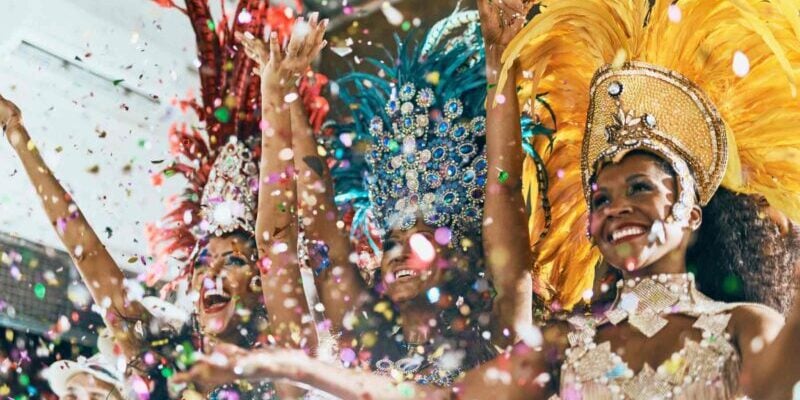 carnival-dancers-in-brazil dancers dressed in vibrant costumes dancing in a Brazilian Carnival parade