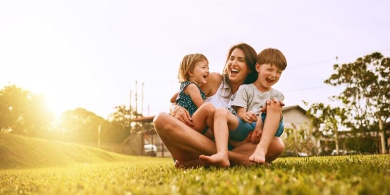 family-outside a mother and her two children enjoying time outside, after moving to Brazil