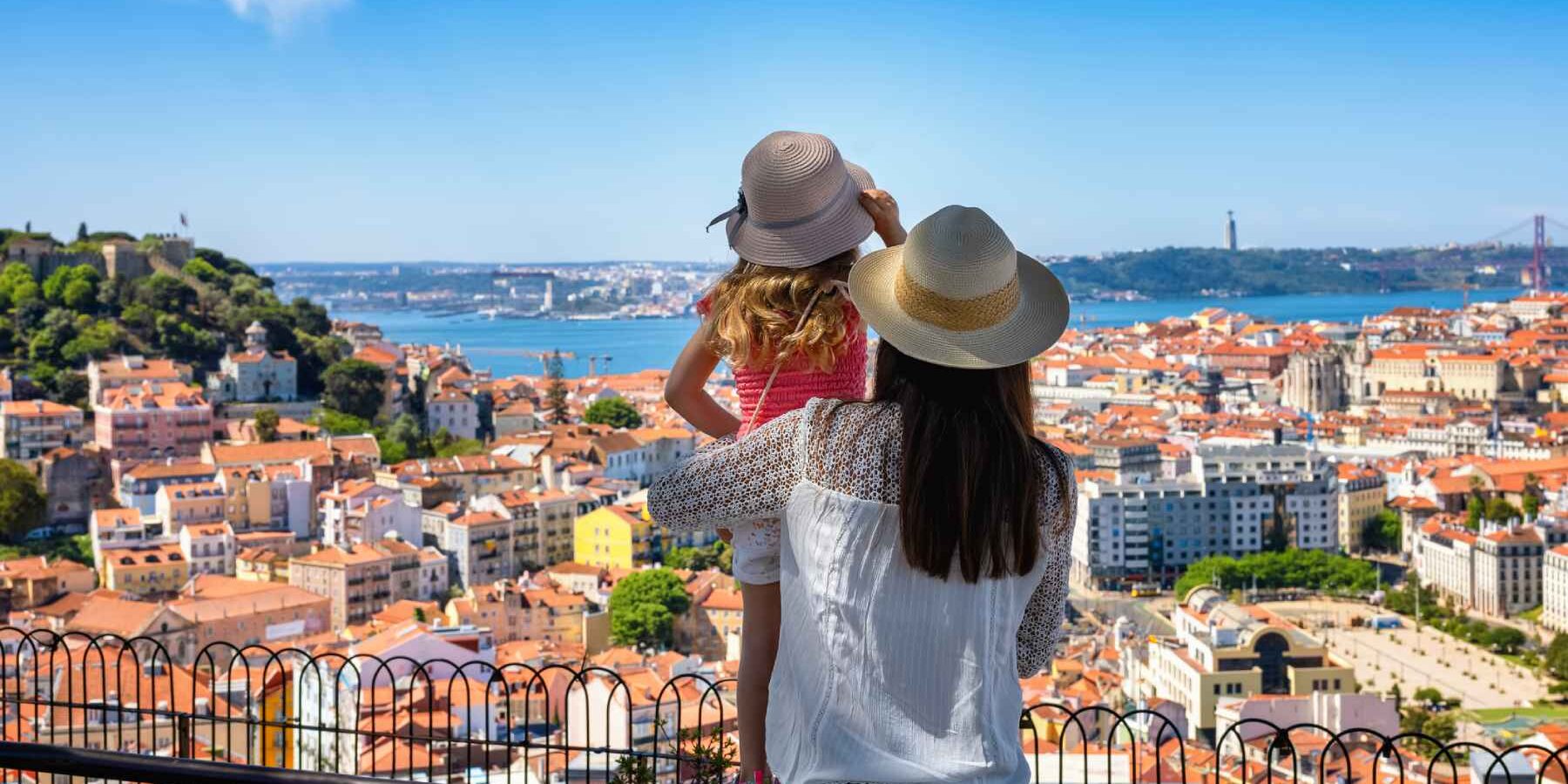 lisbon-portugal a mother and her daughter enjoying the view of the beautiful cityscape of Lisbon, ones of the best places to live in Europe and one of the safest places to live in the world